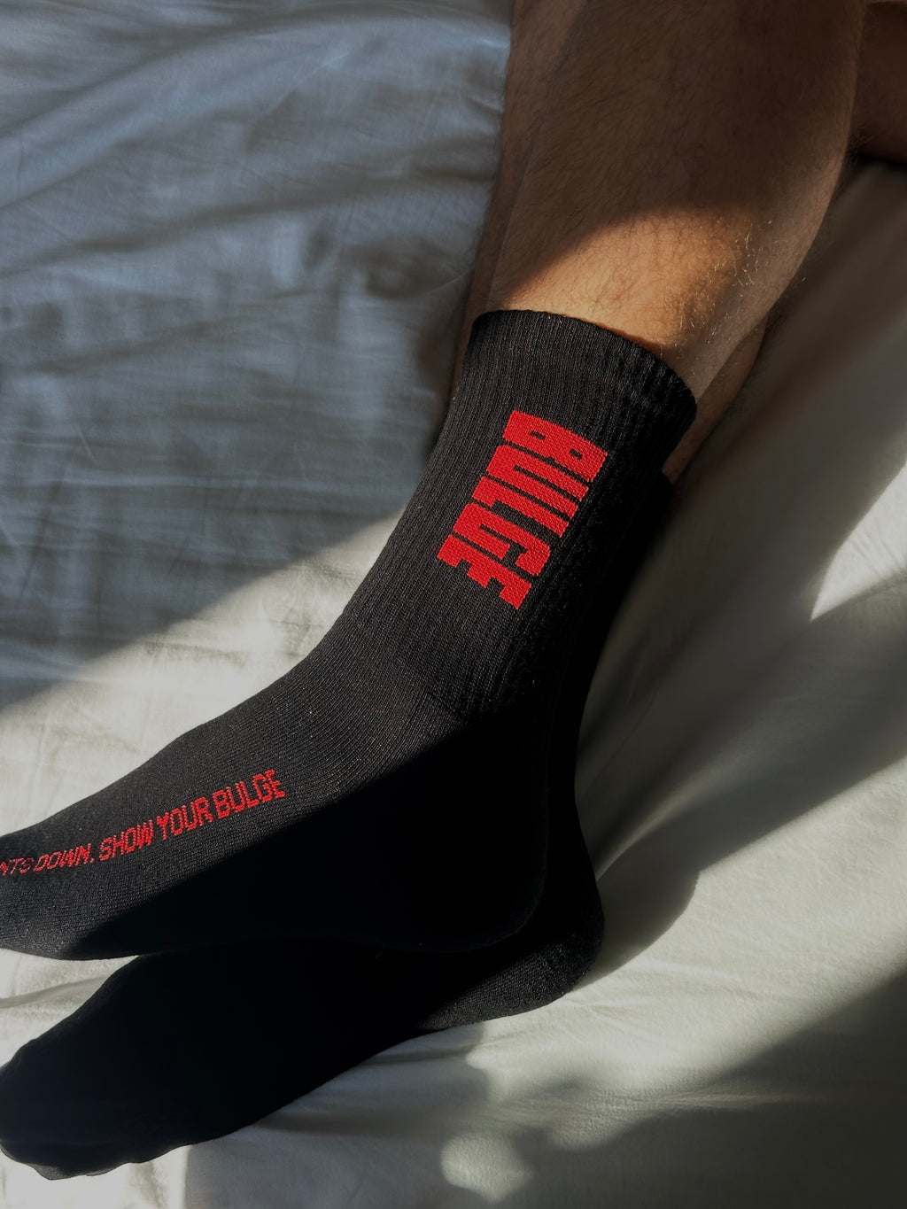 SOCKS SHOW YOUR BULGE BLACK · RED LOGO